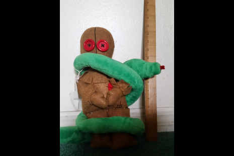Doll shown with ruler to show height